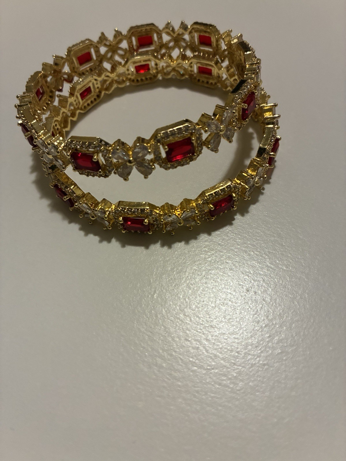 Gold Tone Bangle Bracelets Set with Red Emerald Cut and White Round Stones