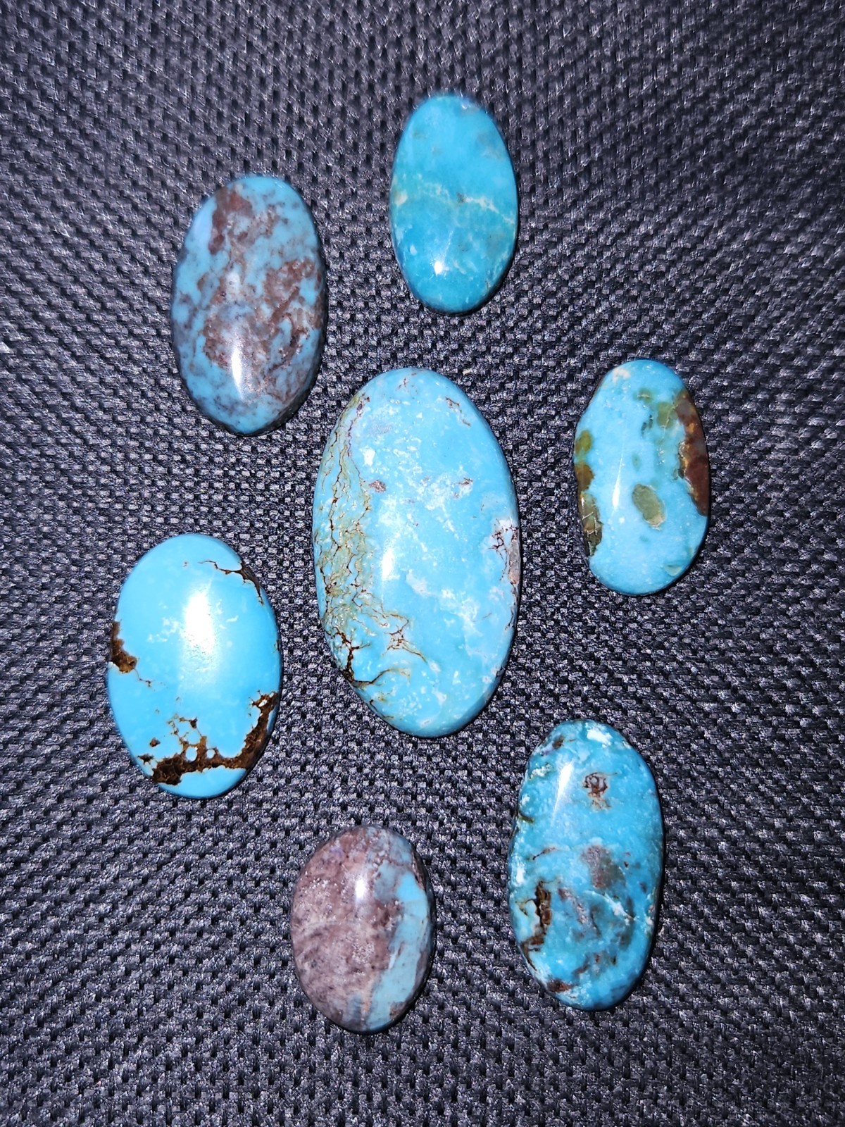 Rare Bisbee Turquoise Ovals – Backed – 7 pieces – 48.905 carats total