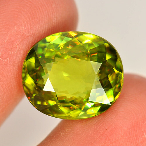 Multi Color Sphene 8.86 Ct. VVS Oval 15.2 x 13.1 Mm. Natural Unheated Gemstone