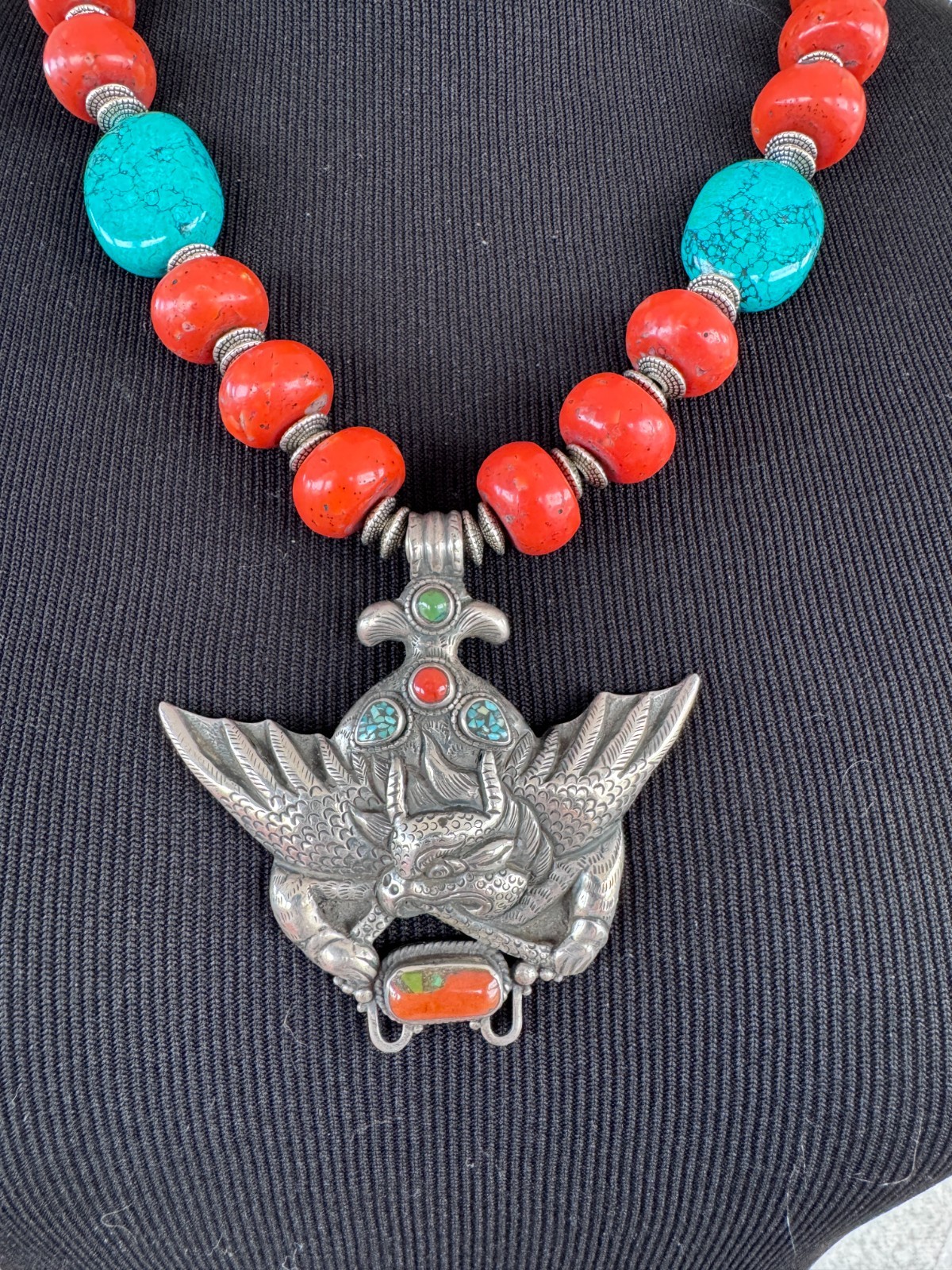 Silver Garuda pendant strung with natural coral and turquoise
