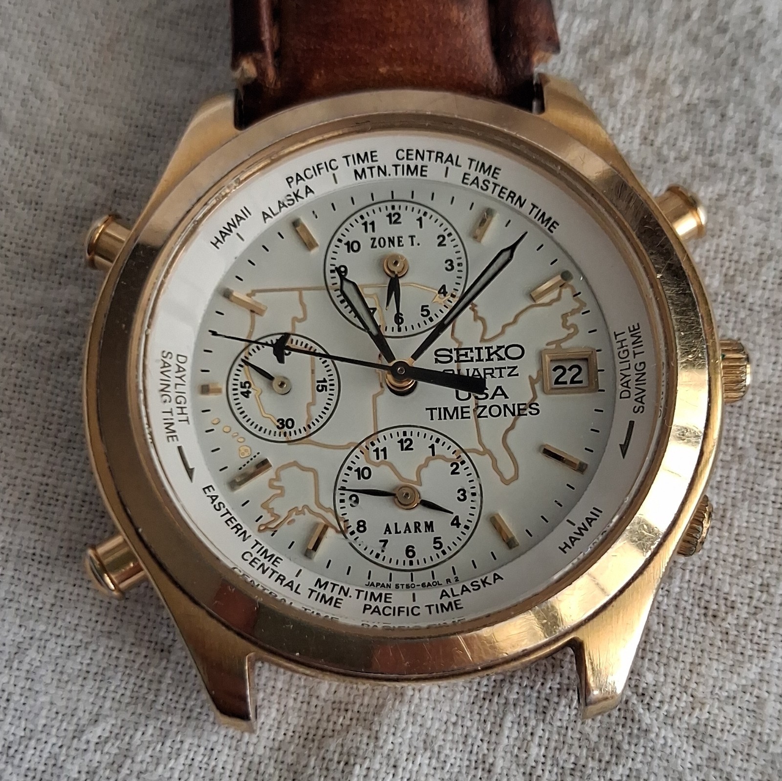 Seiko USA Time Zones Quartz World Time Alarm Date Gold-Tone Leather Band