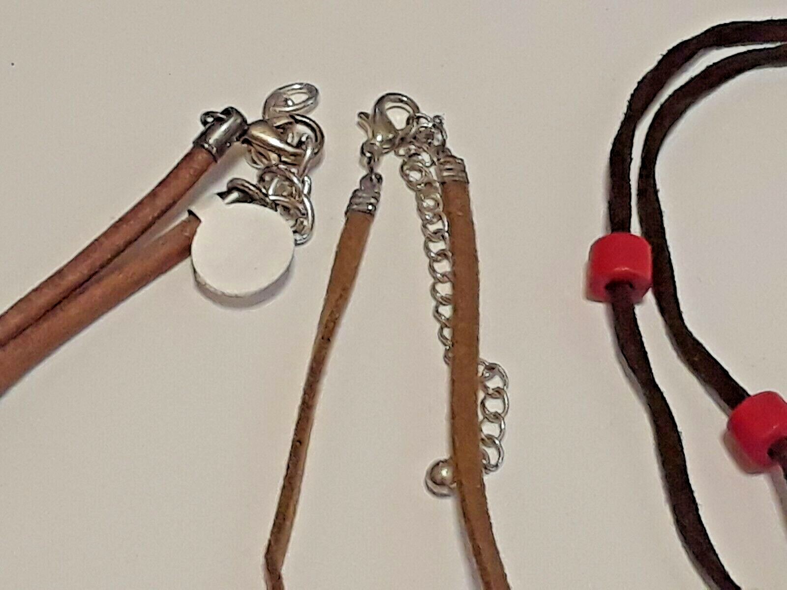 Animal shape pendants silver tone on leather rope chains 18″ long. 5 necklaces