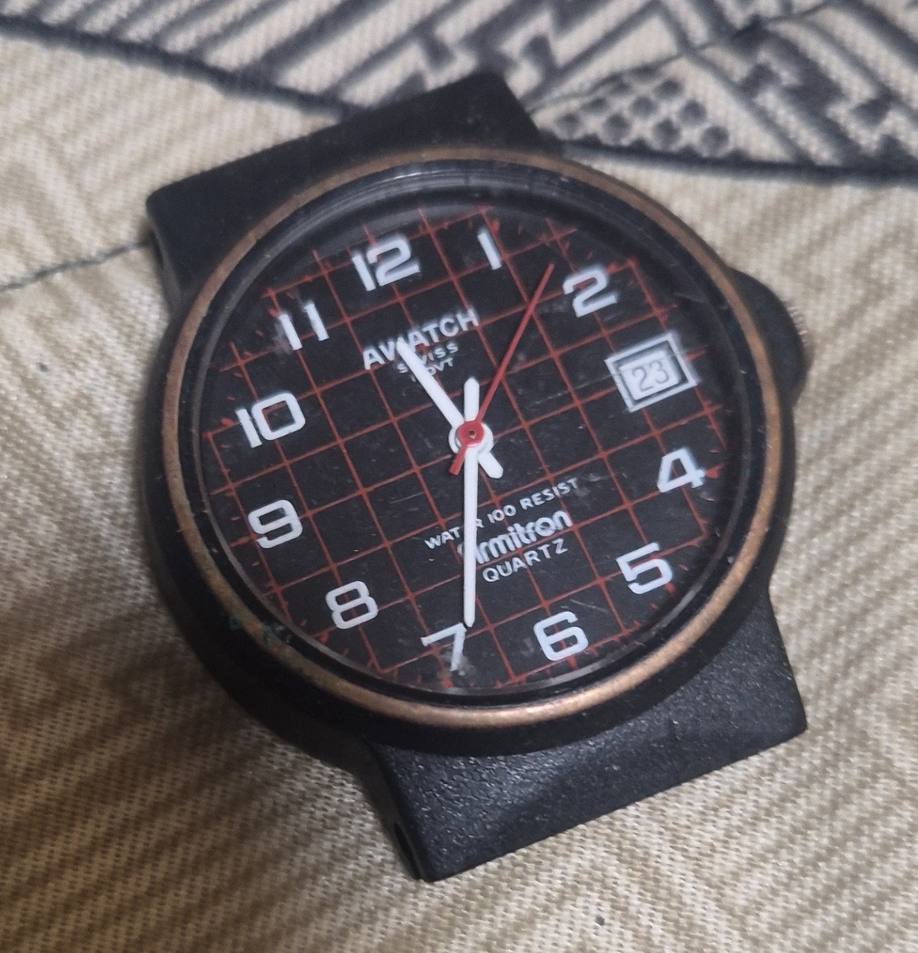 Armitron AWATCH Quartz Analog Watch Date 30m Black Rubber Band Red Grid Dial