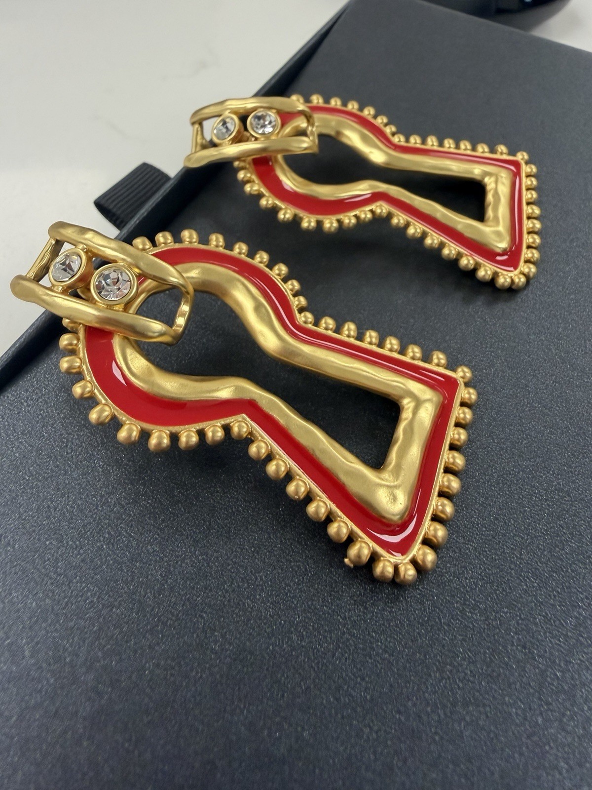 Surrealist, Schiaparelli style, keyhole stud earrings, gold with red enamel