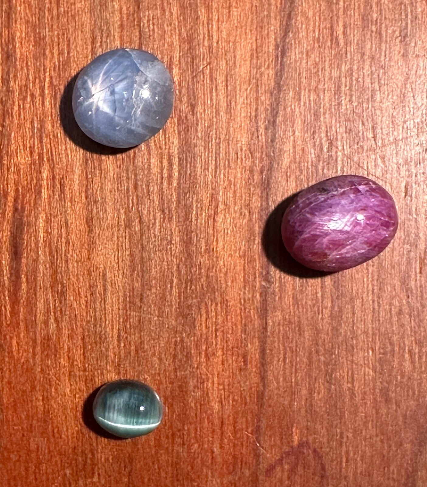 STAR SAPPHIRE CABOCHON 5.25CT, STAR RUBY SAPPHIRE 6.71CT, CAT’S EYE TOURMALINE 1
