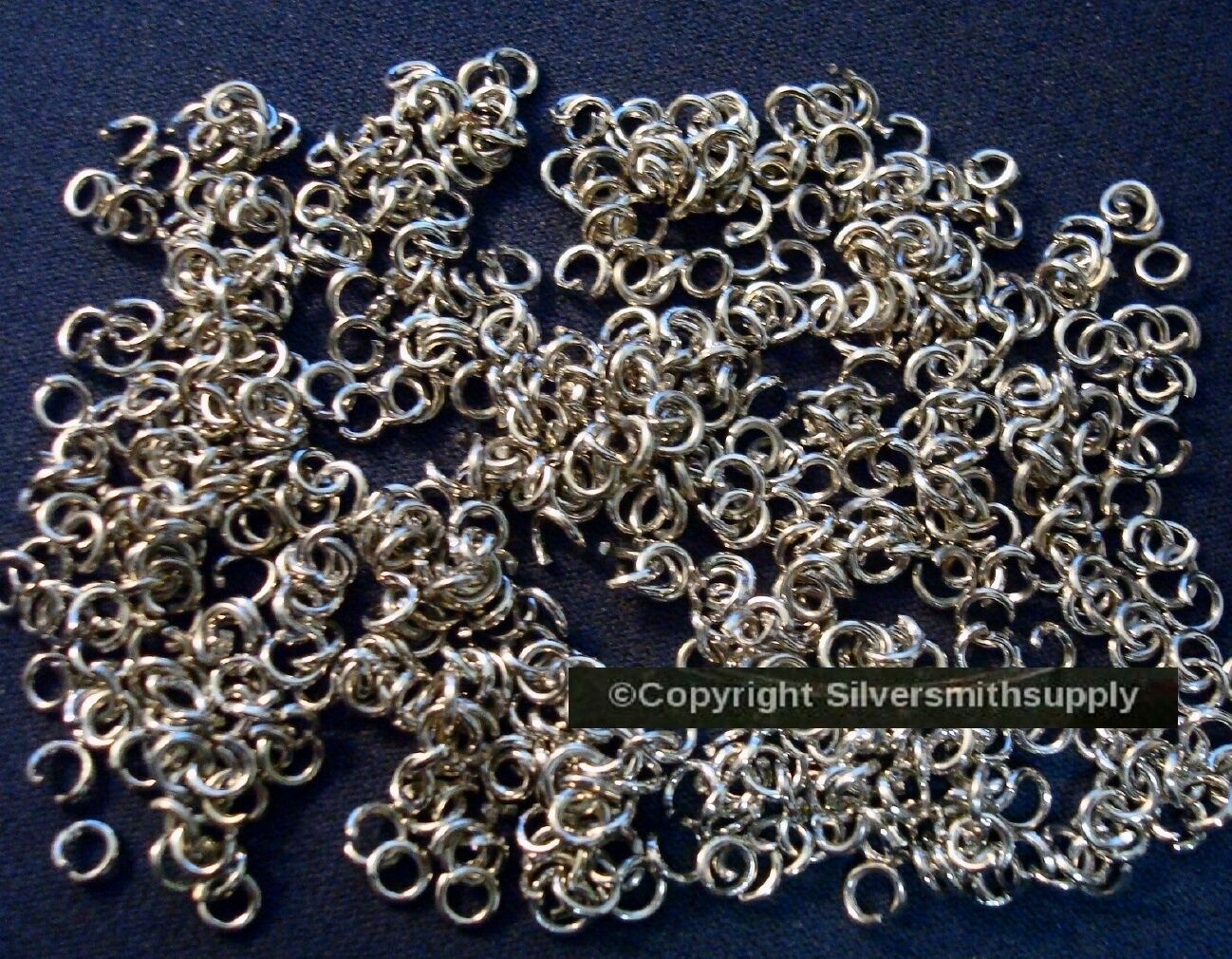 3mm (approximately) White gold pltd heavy ga jump rings 500 piece lot FPJ088