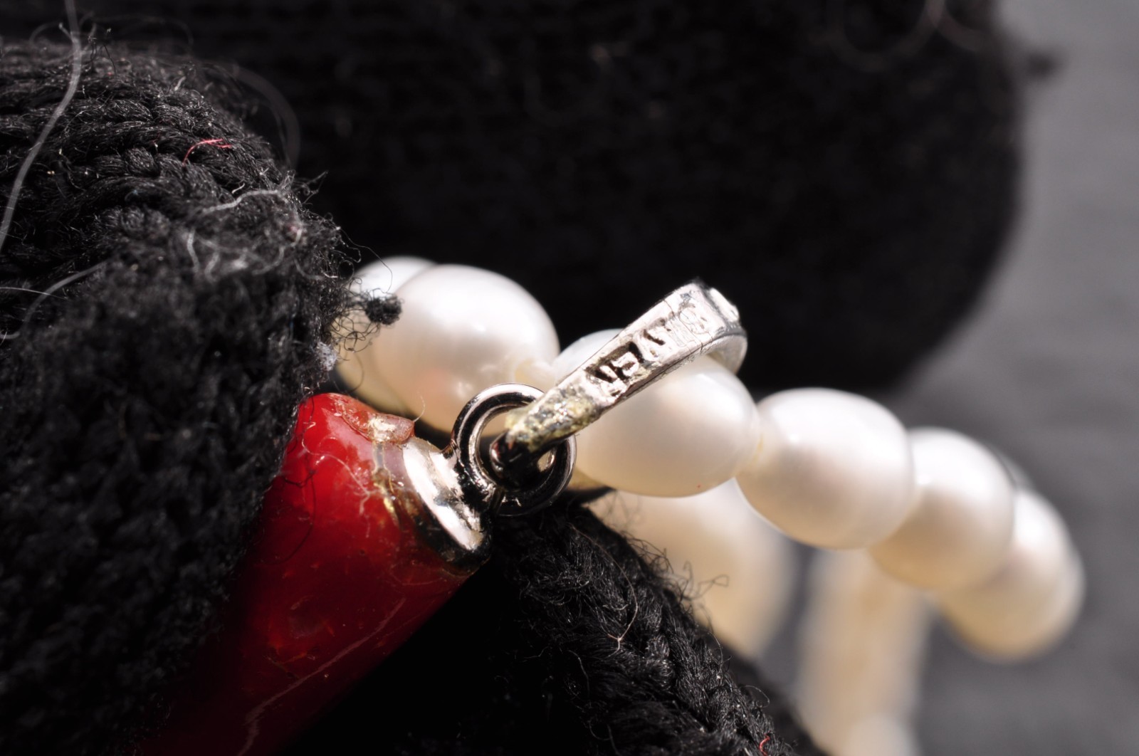 Sterling silver clasp, red coral and pearl pendant (total 54.0ct) Certification.