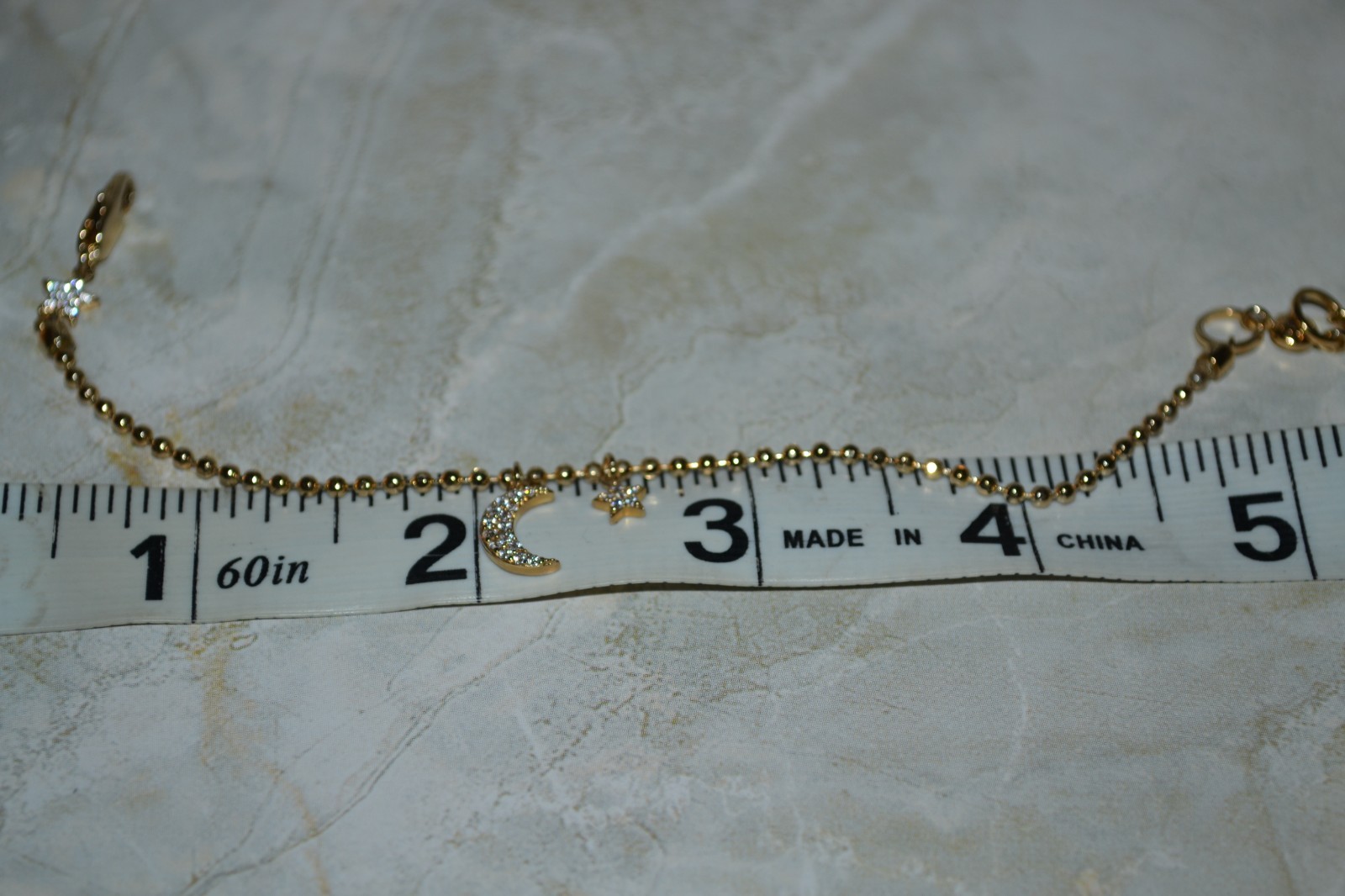 Henri Bendel Chain Bracelet with Star and Moon Charm