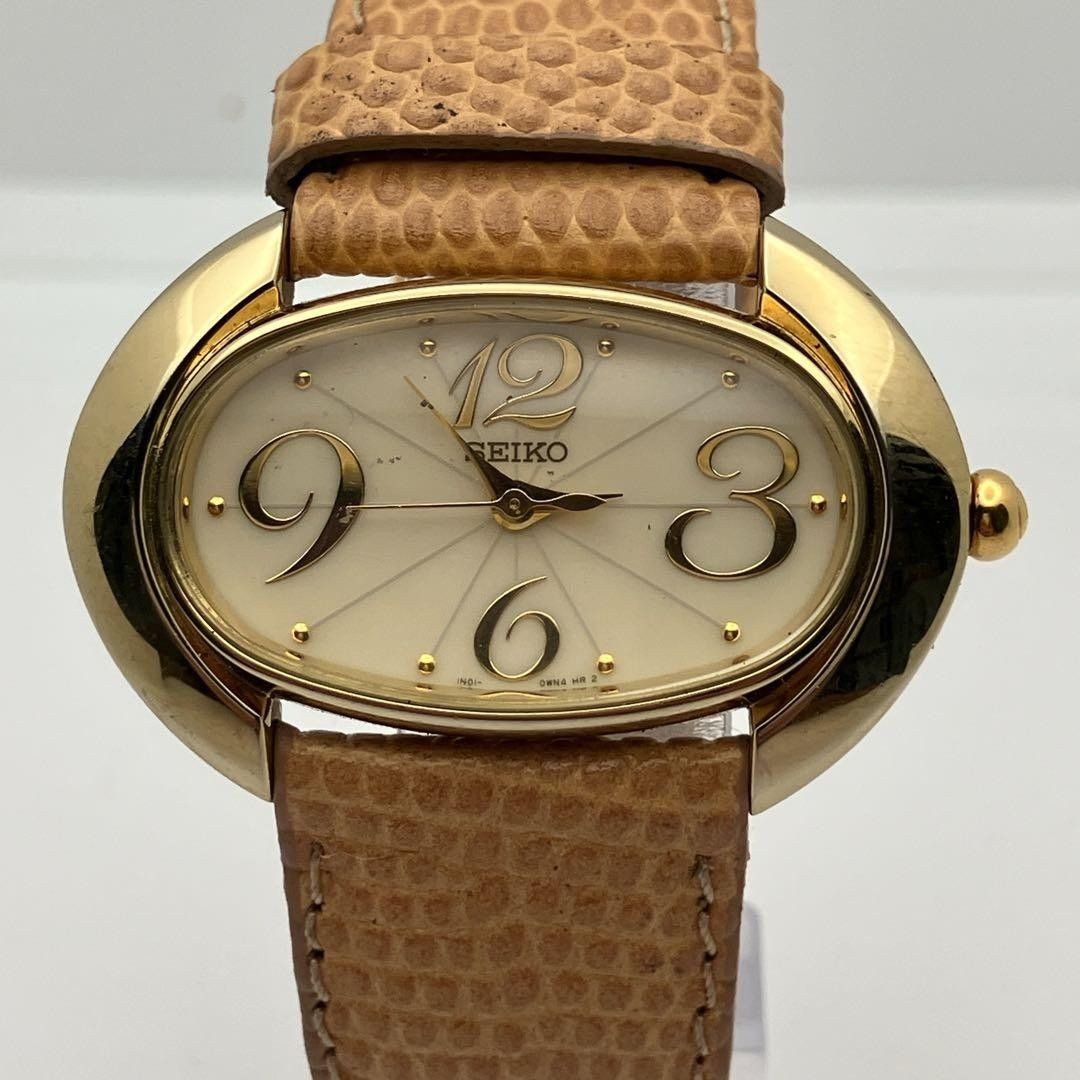 Working item SEIKO wristwatch oval quartz new battery ladies