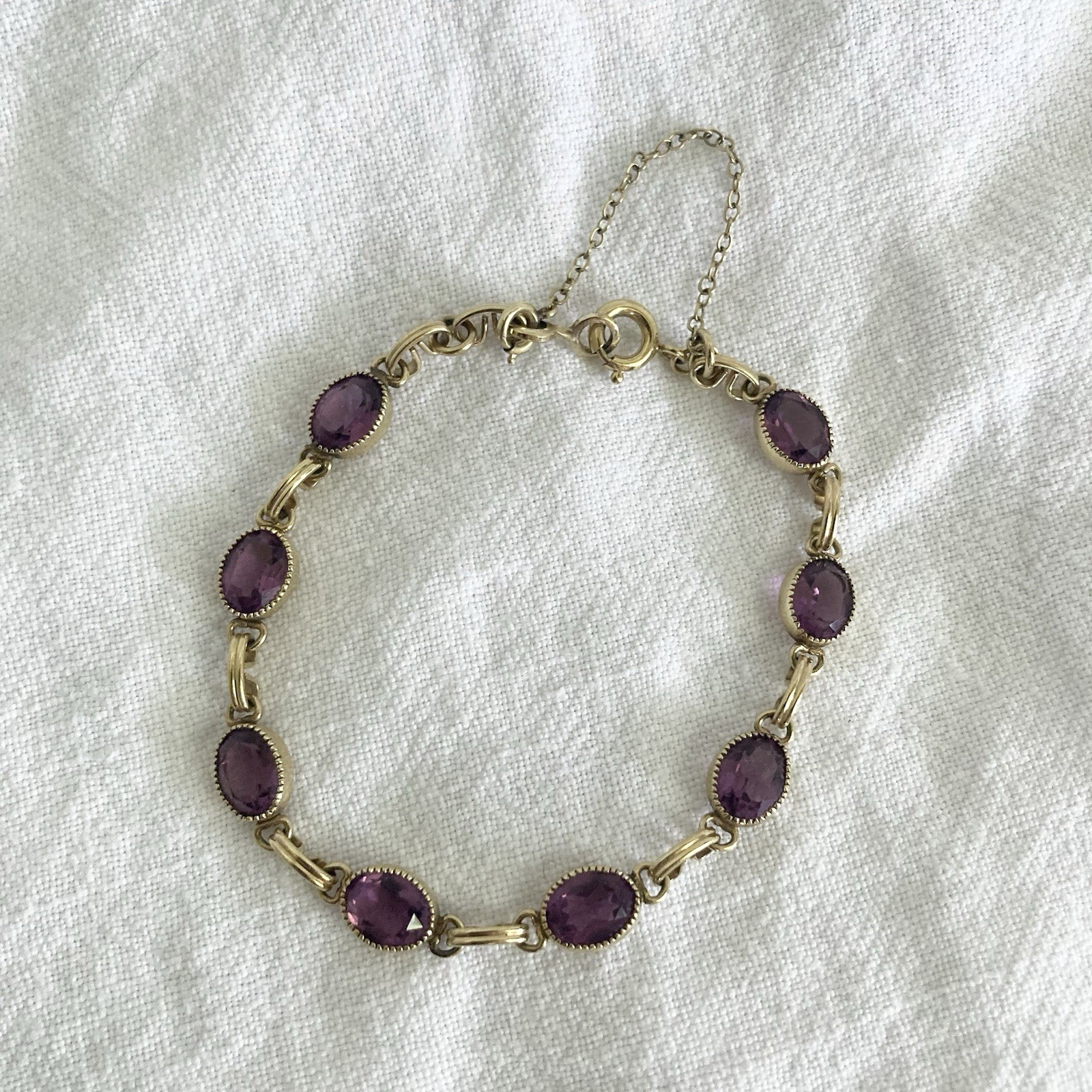 VINTAGE GOLD FILLED 7.5 INCH LONG BRACELET W/ OVAL FACETED PURPLE STONES