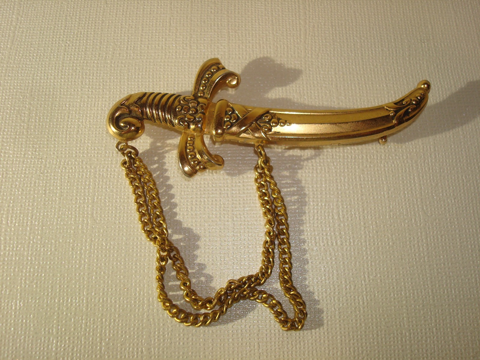 VINTAGE LOT(3) BROOCHES,CHINESE DRAGON,J.J RUSSIAN CATHEDRAL,M/EAST DAGGER PERF.