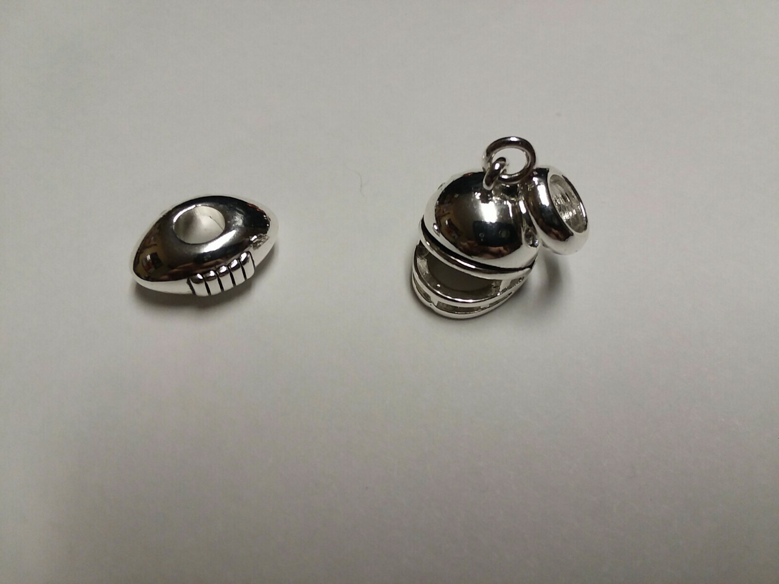 Davinci jewelry. Football Bead and Football Helmet Charm. New. LOOK!!