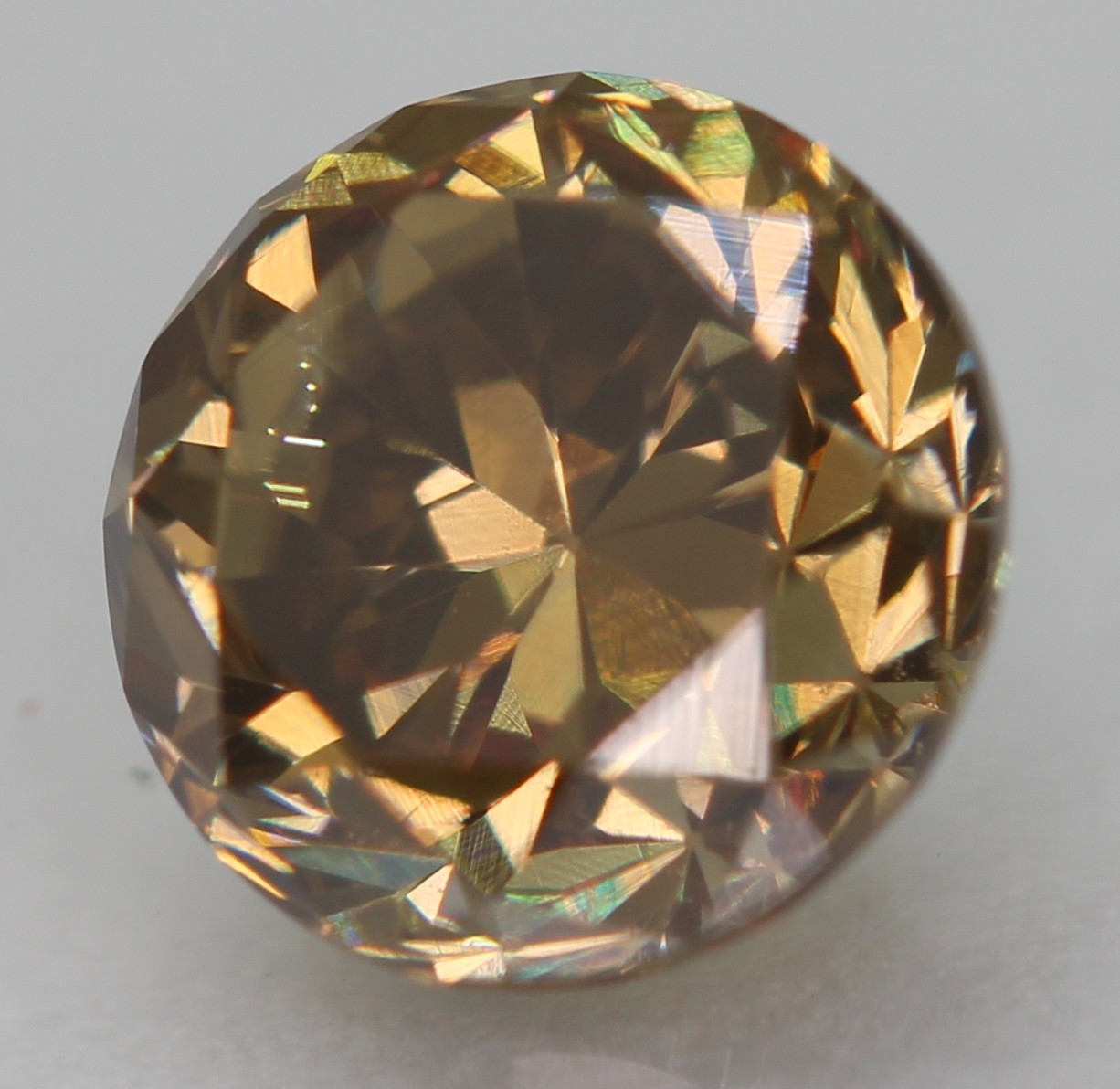 0.63 Ct Yellow Brown VVS2 Round Brilliant Natural Enhanced Diamond 5.18mm VIDEO