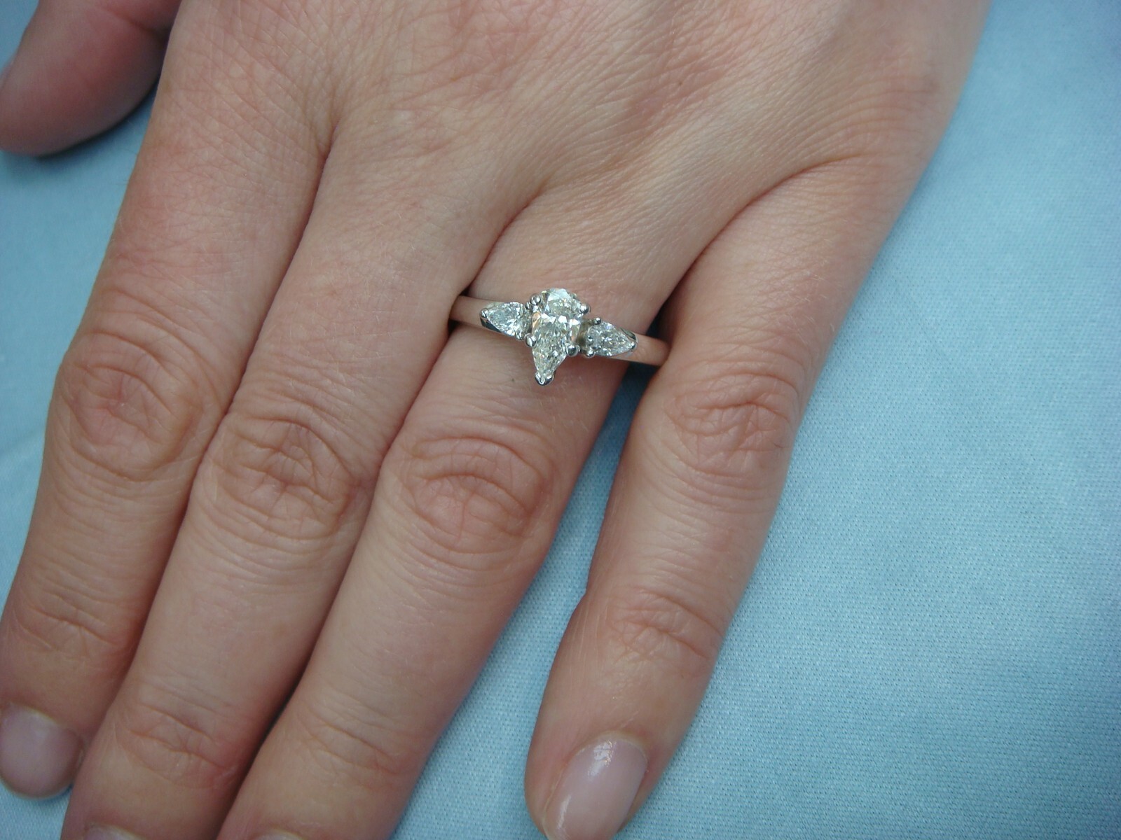 18 KT GOLD 0.70 CARAT T.W. PEAR SHAPE & 2 PEAR SHAPE IN SETTING GENUINE DIAMONDS