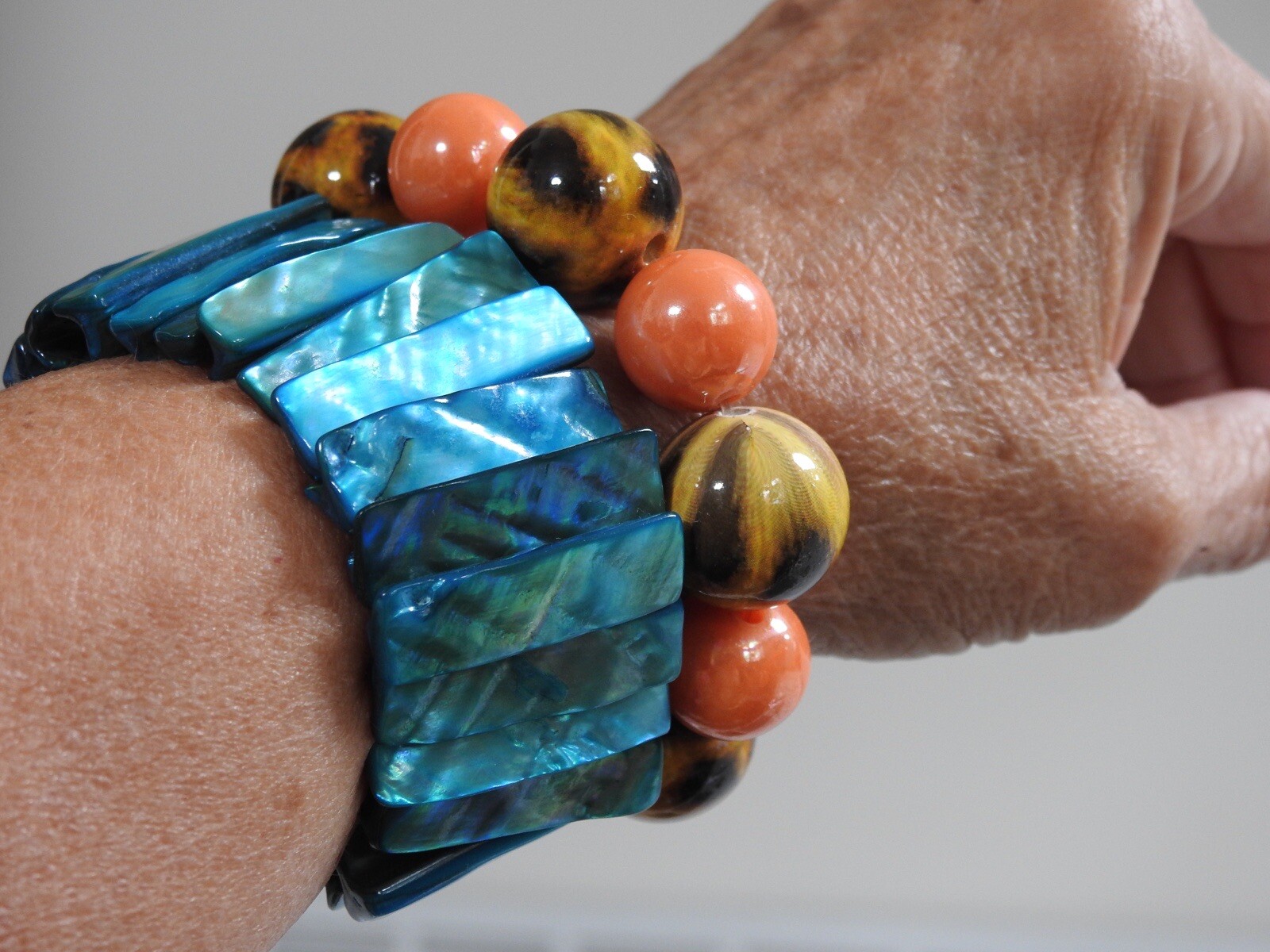 Pair SUMMER STRETCH BRACELETS 1 blue MOP, 1 orange/brown/yellow balls