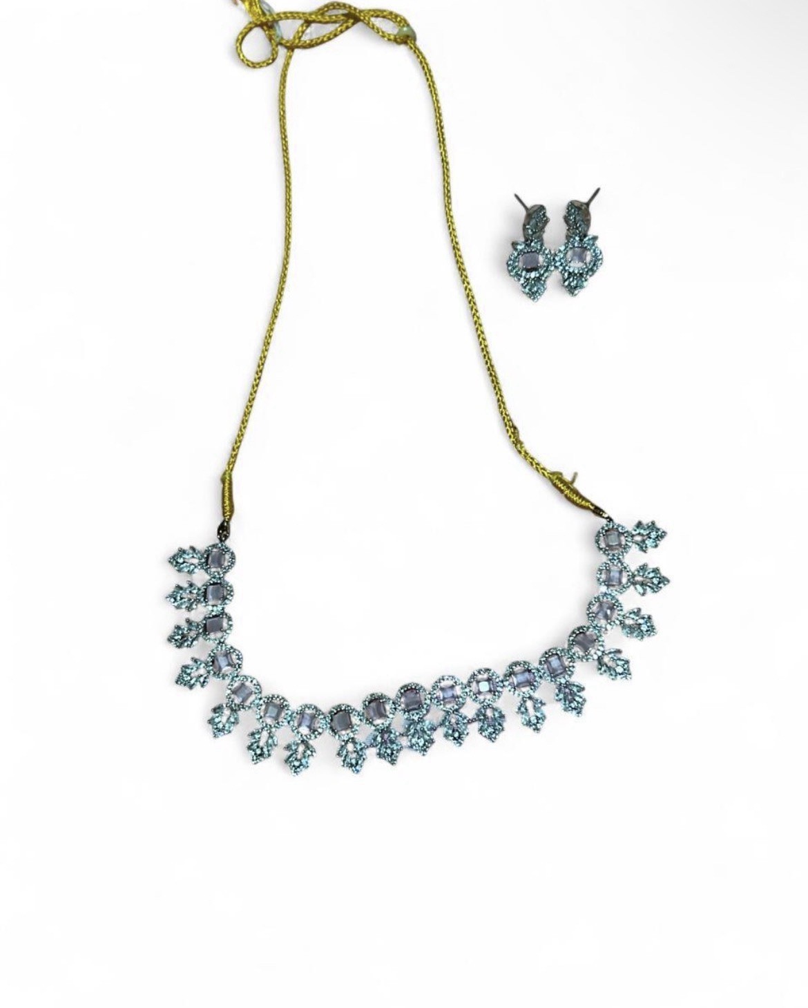 Silver necklace with crystal embellishments and matching earring