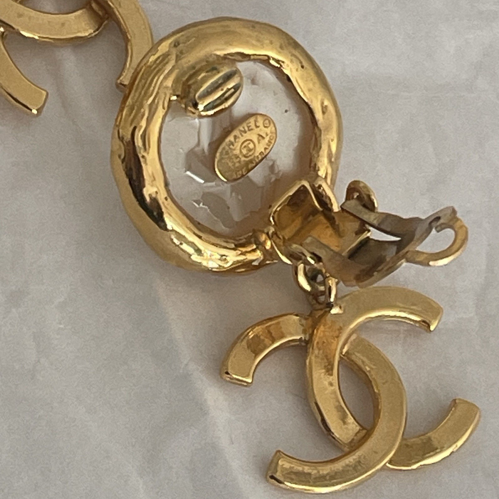 Auth. vtg CHANEL 1995 gold 3D CC logo dangle with round moonlight stone stamped