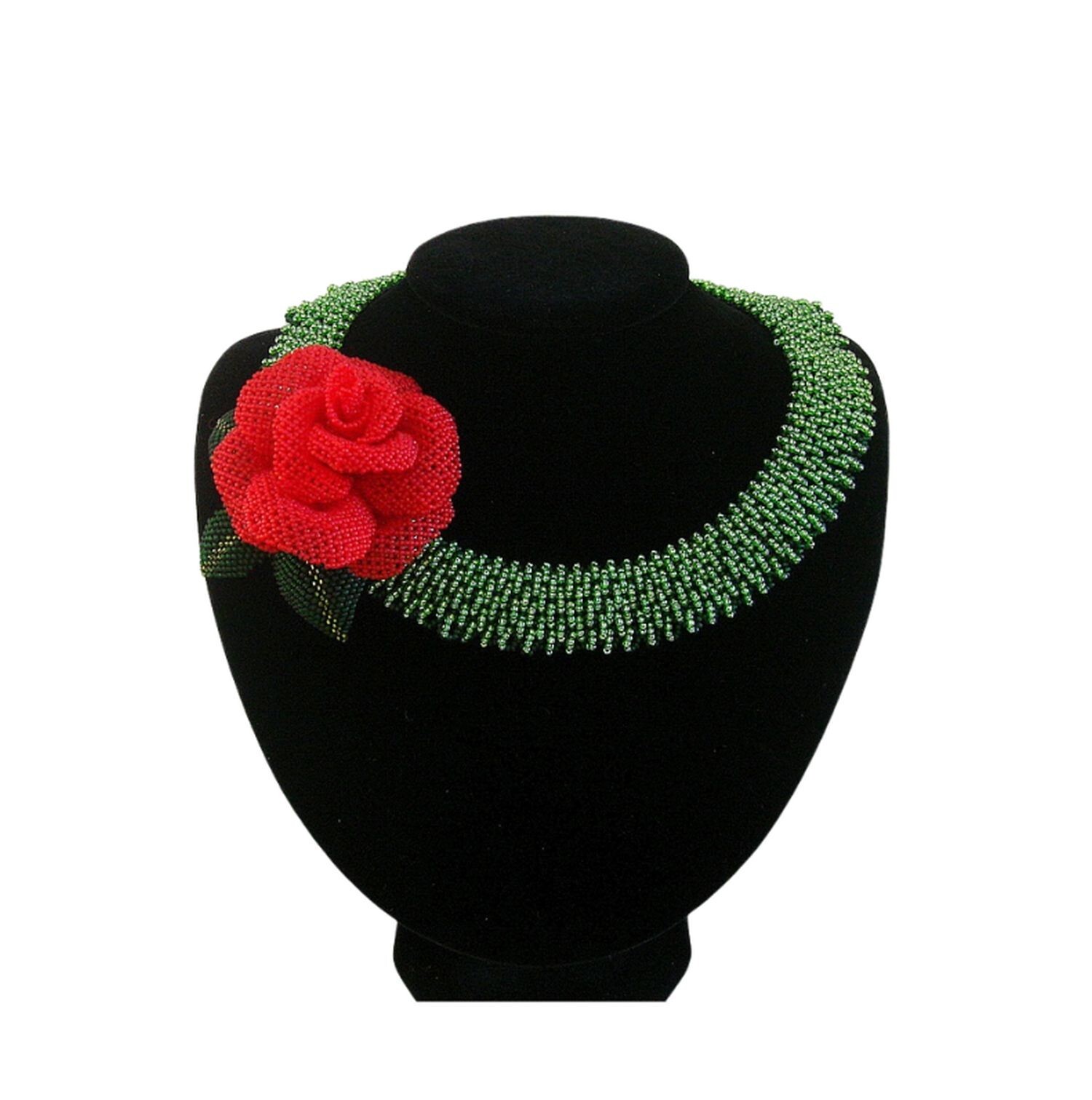 Handmade green beaded necklace with red rose centerpiece.