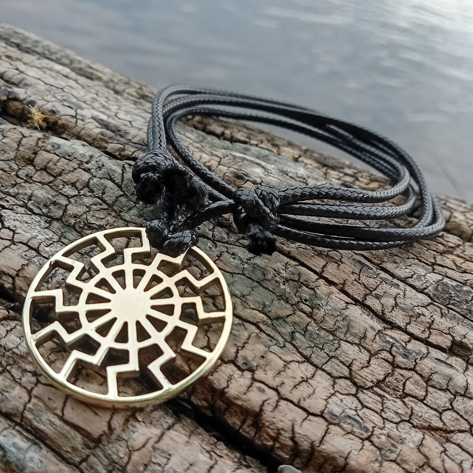 Black Sun Pendant Necklace – Brass Sonnenrad Medallion on Black Cord