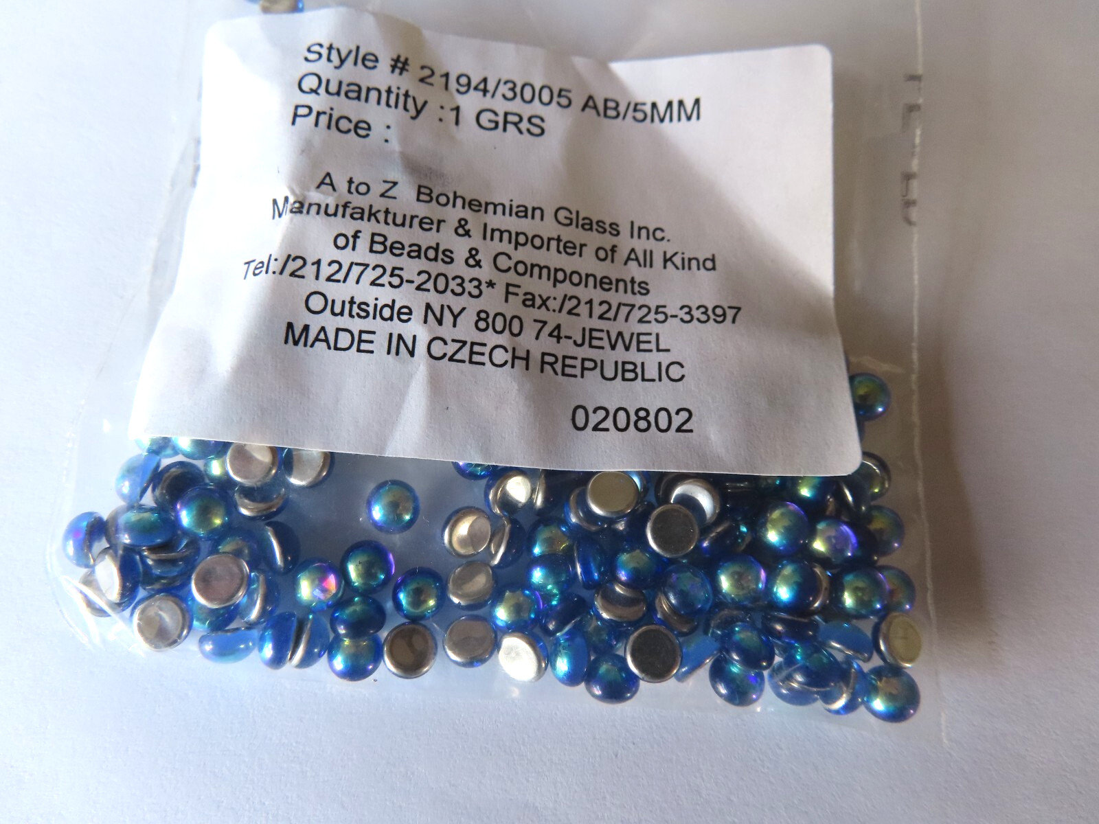 144 Czech. Glass round cabochones 5mm Sapphire AB/foiled.