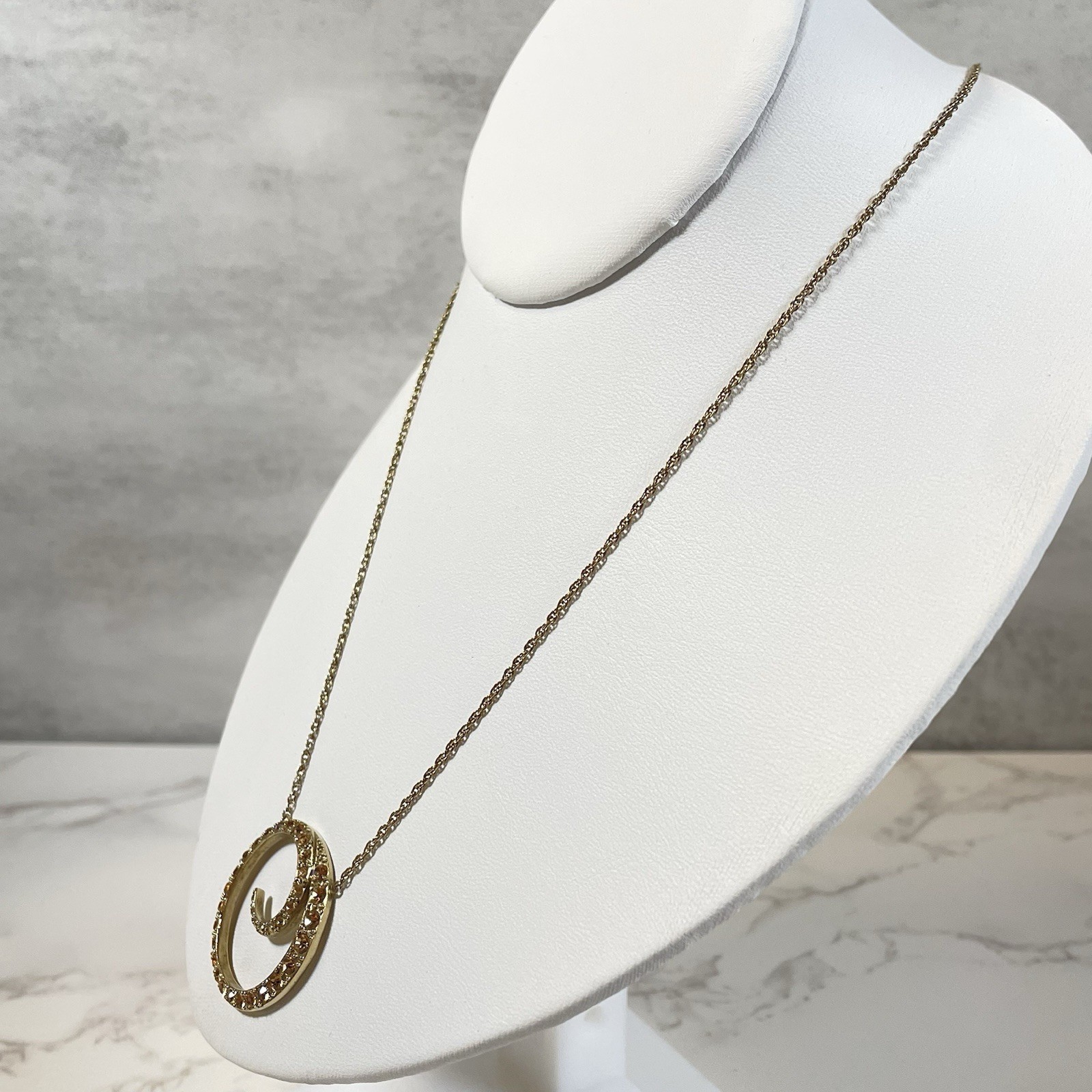 Vintage Monet Gold Tone Topaz Rhinestone Swirl Circle Pendant Necklace Chain 16″