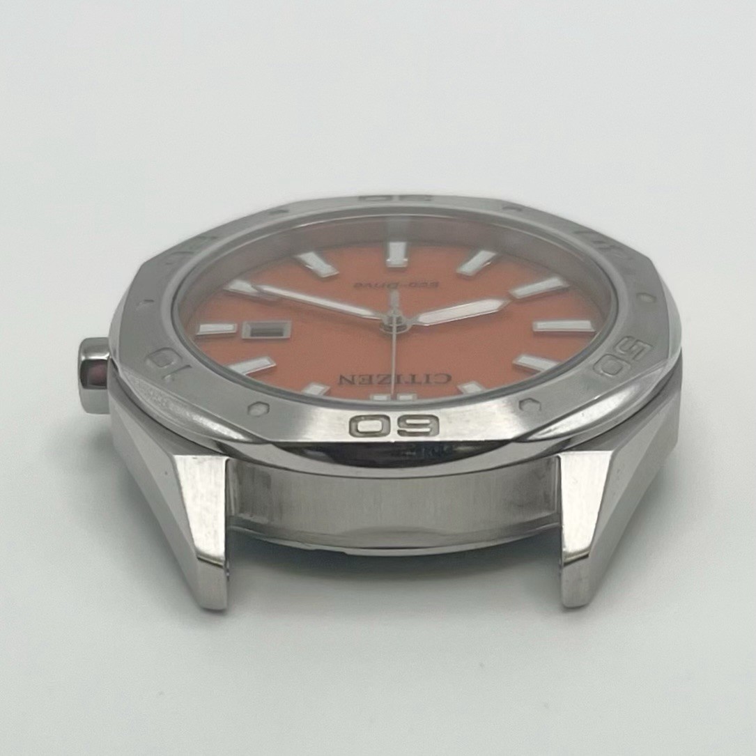 Citizen Eco-Drive Quartz Orange Waffle Dial Date 10 BAR WR E111-009R501 42mm
