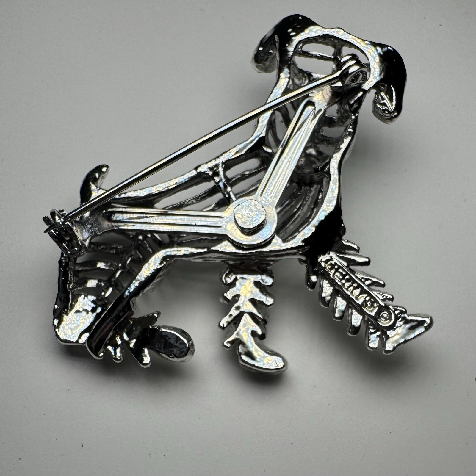 Vintages Gerry’s Silver Tone Dog Brooch Blue Rhinestone Eyes Animal Theme 2 Inch