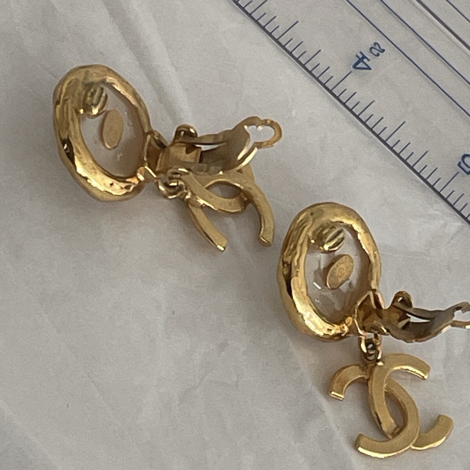 Auth. vtg CHANEL 1995 gold 3D CC logo dangle with round moonlight stone stamped