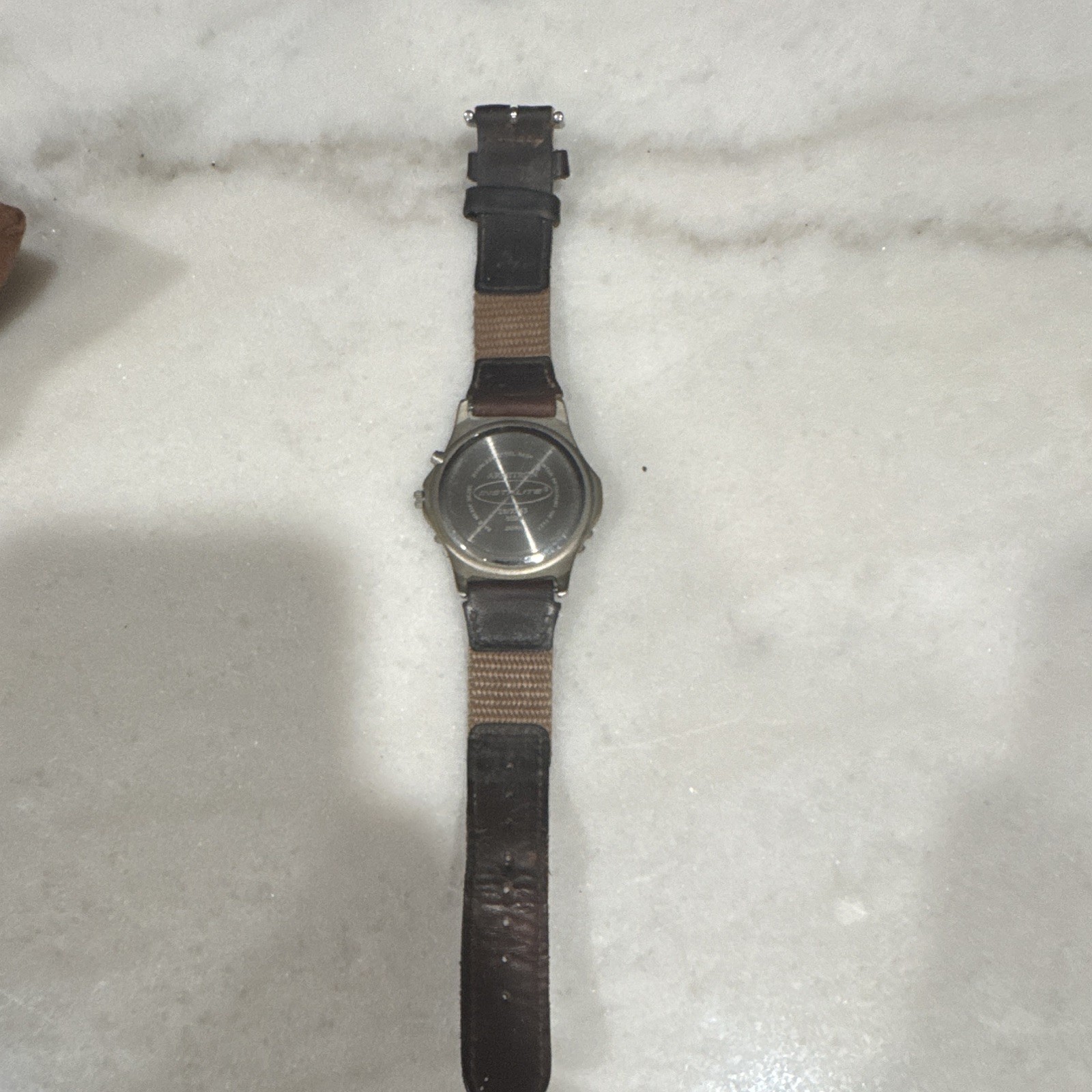 Armitron Instalite Quartz Analog Watch White Dial Arabic Date Brown Leather 100m