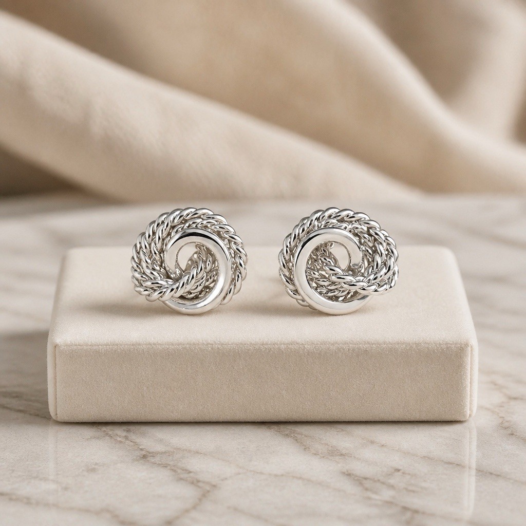 Monet Silver Tone Love Knot Textured Clip On Earrings-Vintage