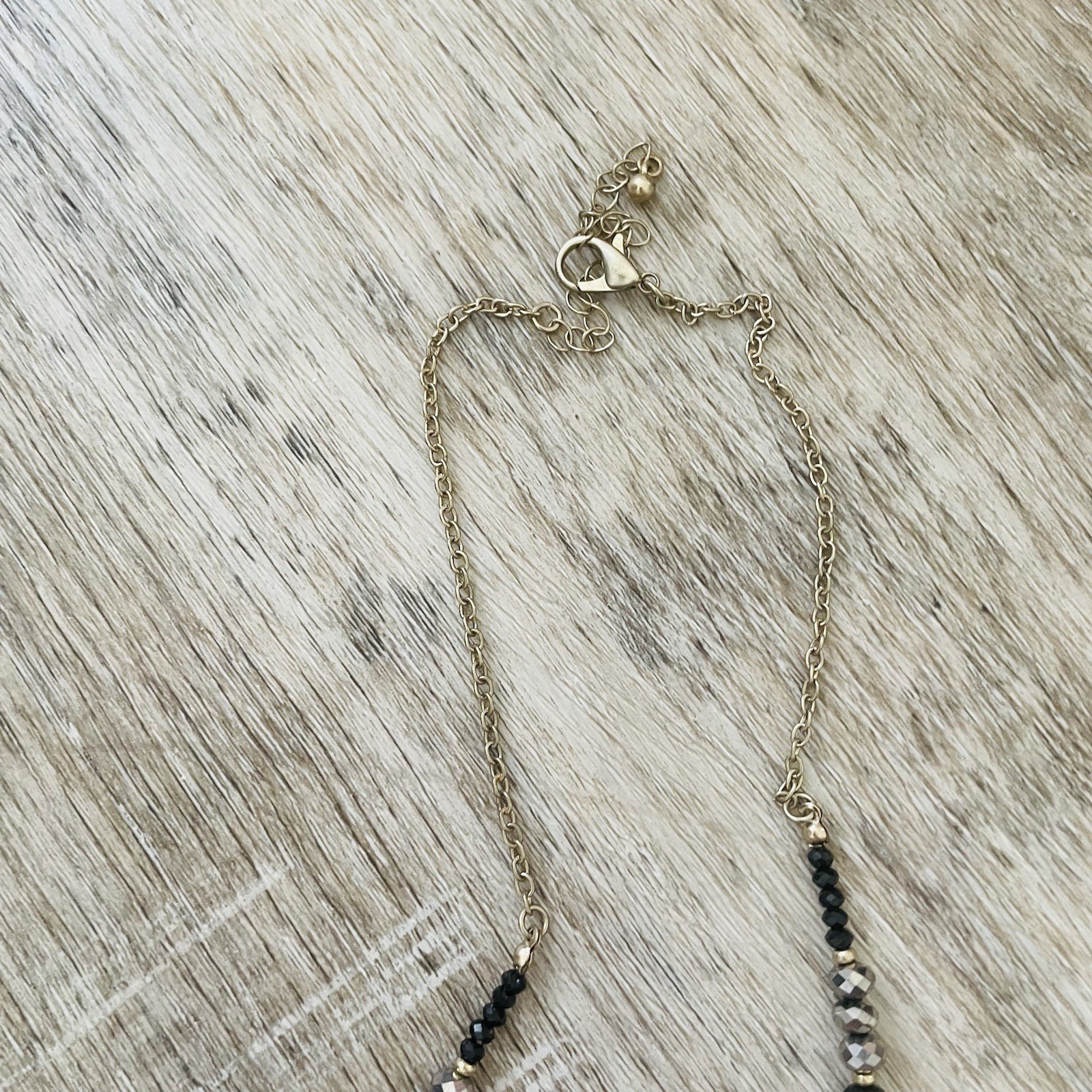 Gold Double Ring Pendant Necklace with Black and Gray Beads