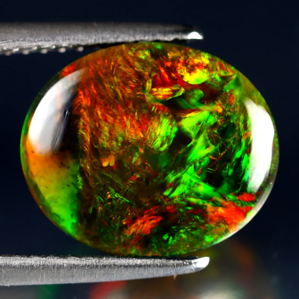 3.45 ct Oval Cabochon(12.01 x 10.02 mm)Ethiopian 360 Degree Flashing Black Opal
