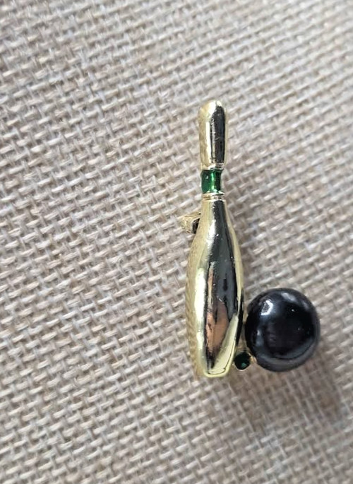 Vintage signed Gerry’s bowling ball brooch. Gold with green rhinestone.