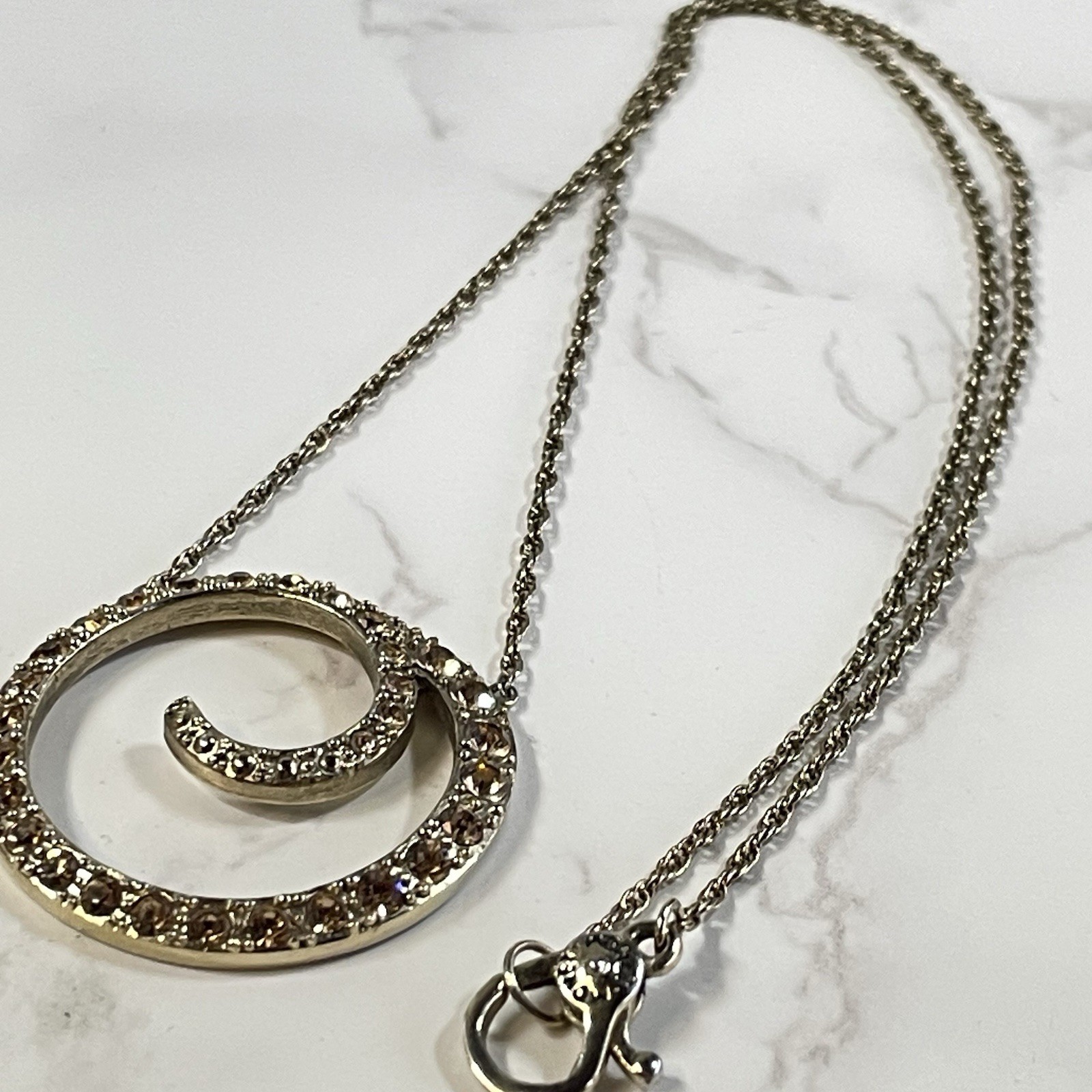 Vintage Monet Gold Tone Topaz Rhinestone Swirl Circle Pendant Necklace Chain 16″