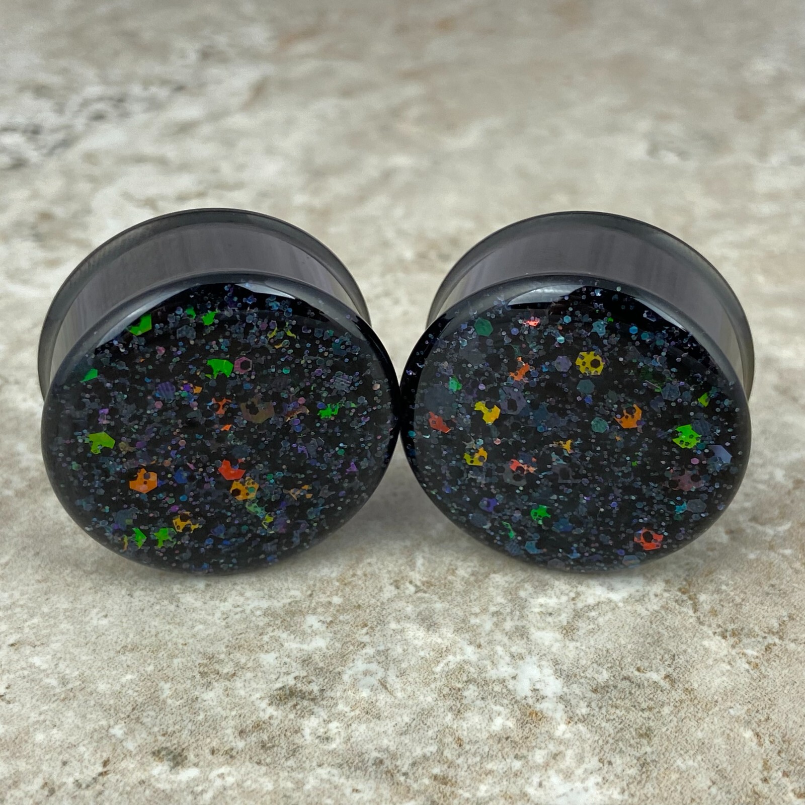 Black Steel Double Flare Plugs with Deep Space Glitter (EMB-031) gauges pair