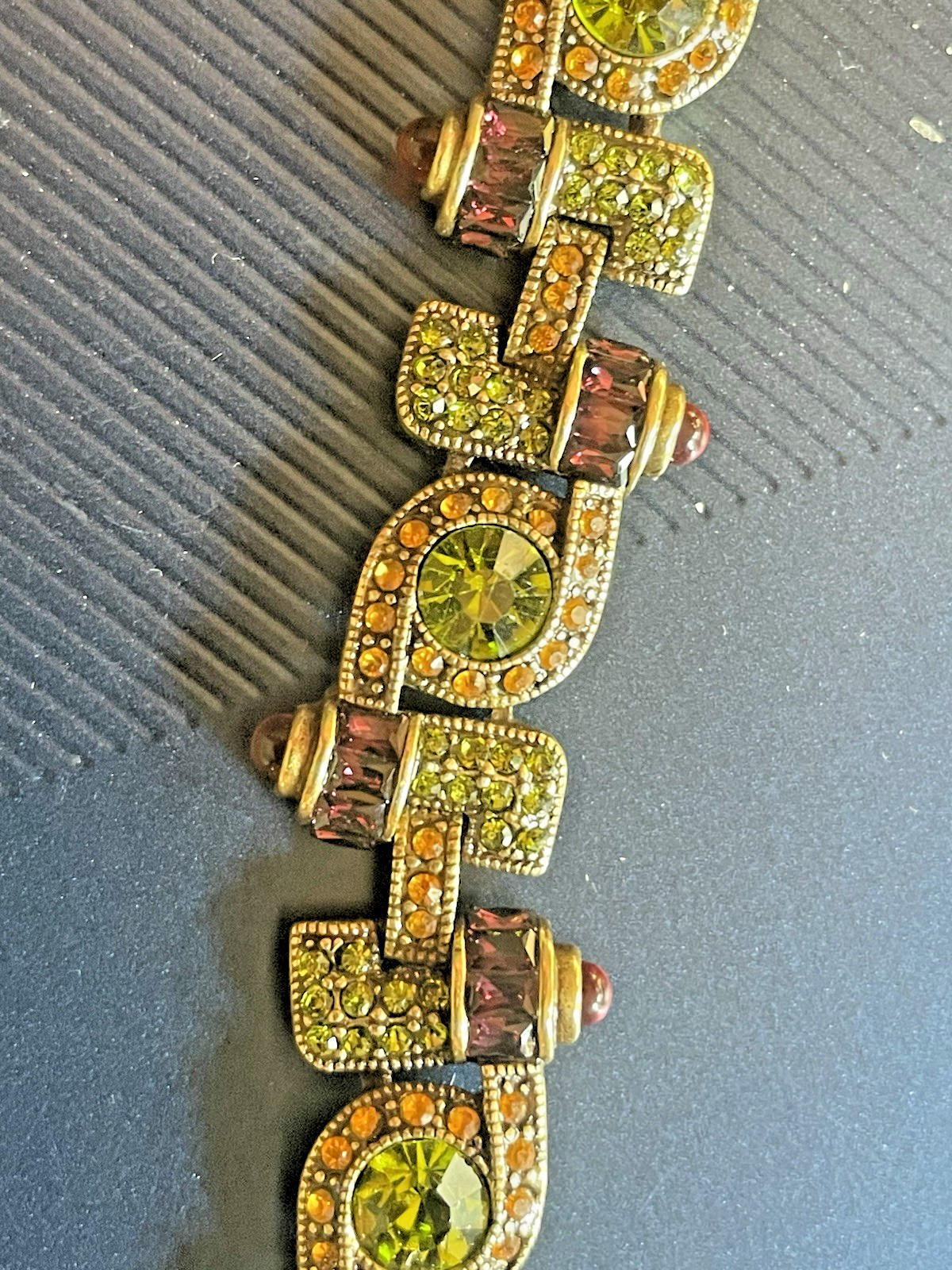 New Heidi Daus Bracelet in Original Packing. Olive Green, Red, Yellow Crystals.