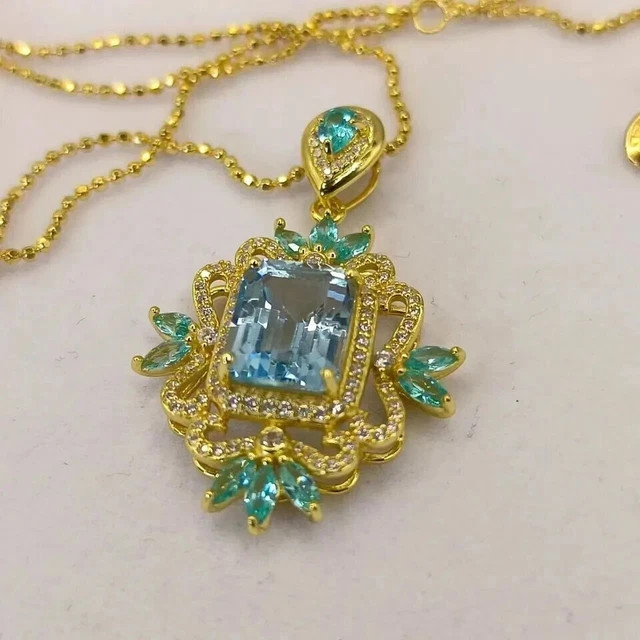 3 Ct Oval Lab Created Blue Topaz Women’s Art Deco Pendant 14K Yellow Gold Plated