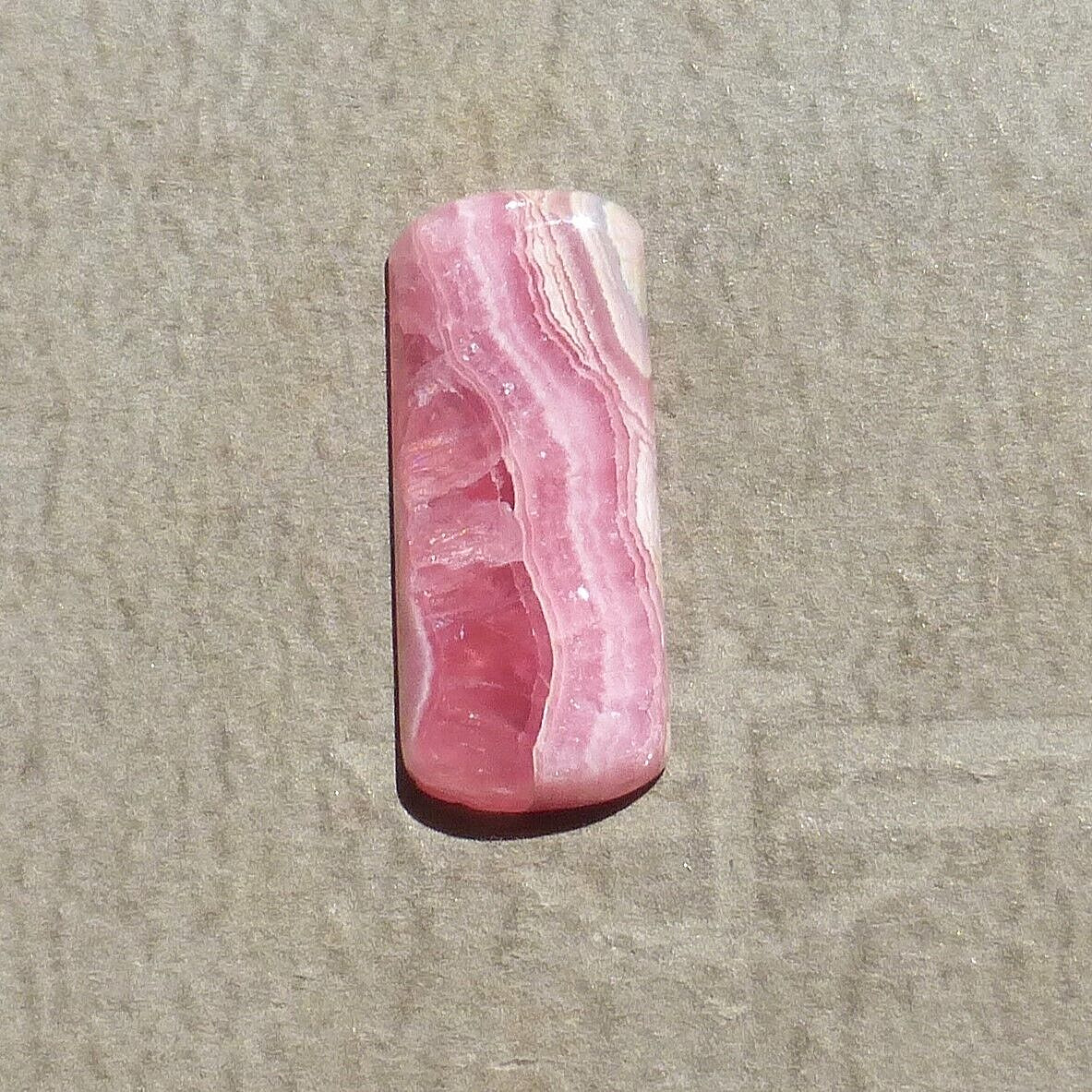 Pink w/calcite banding natural Rhodochrosite cabochon Argentina (27.60 carats)