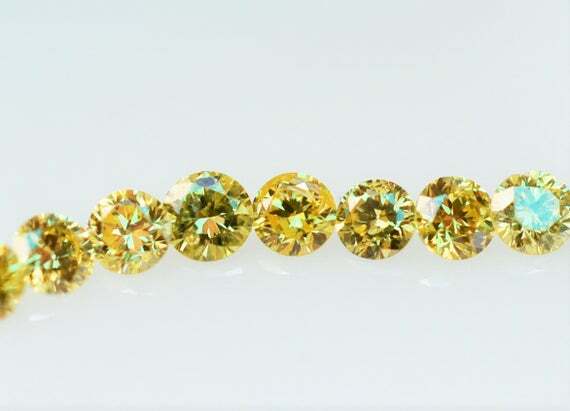 loose individual round diamond melee 2.3mm SI1 yellow 0.05ct colored Natural