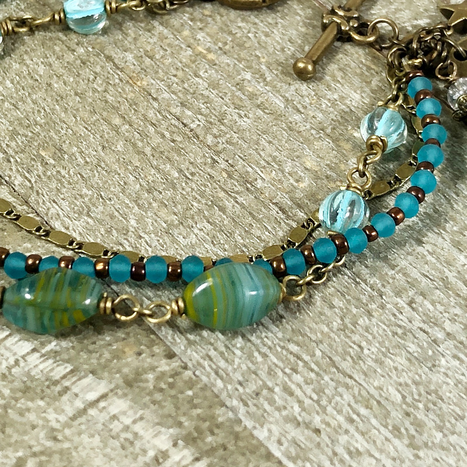 Boho Bronze Triple Strand Bracelet with Turquoise Hurricane Glass Beads