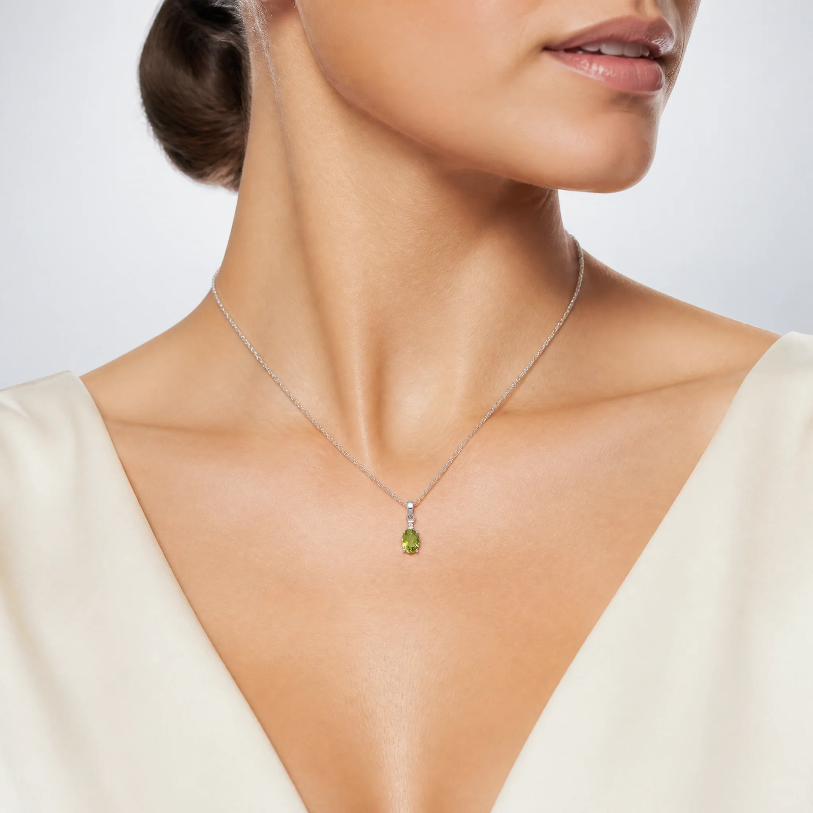 Sterling Silver Rhodium Plated Diamond And Peridot Oval Pendant