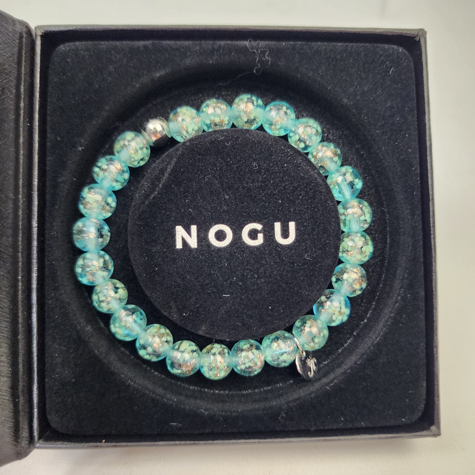 Nogu Teal .925 Sterling Firefly Glow in the Dark Glass Stretch Bracelet NIB