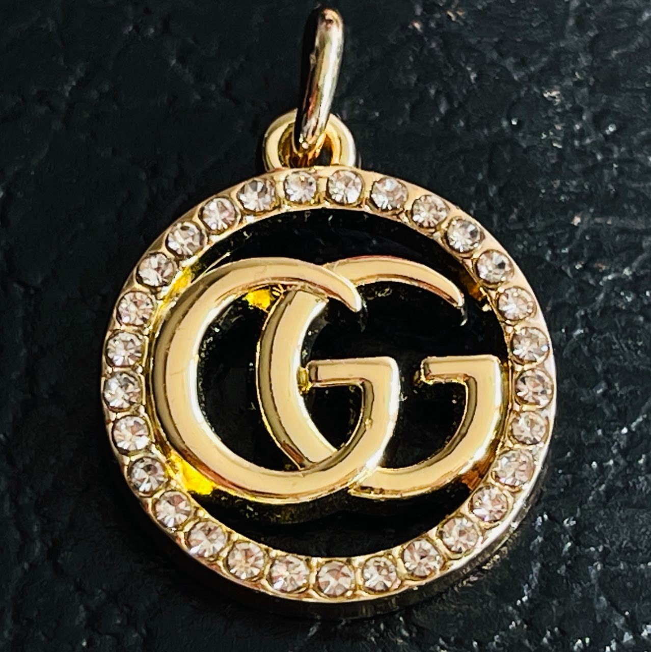 One Gucci Pendant rinestones stamped