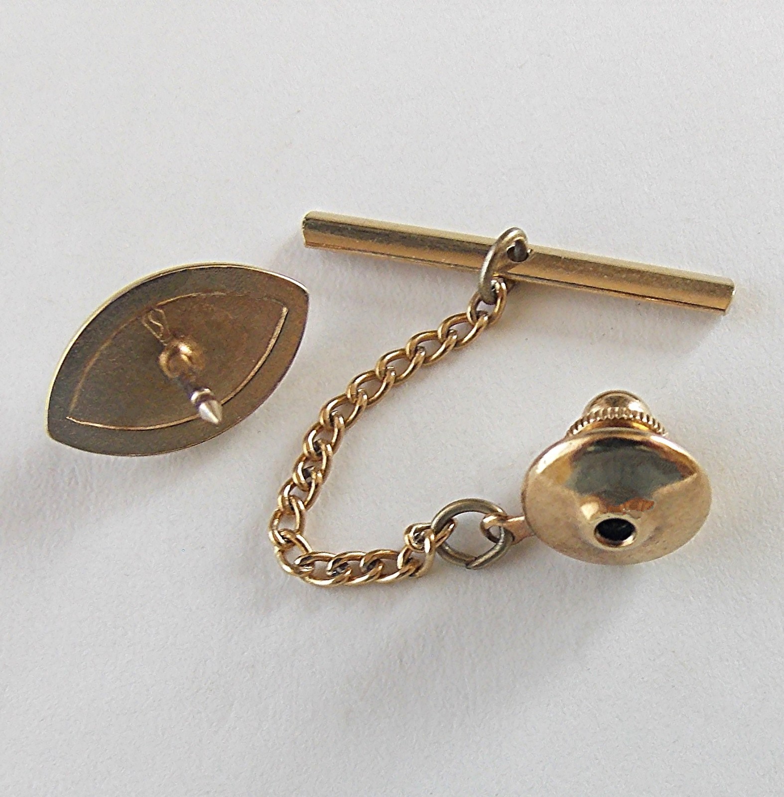 VTG. 40’s SWANK STAMPED “S” IN A PENTAGON GOLD PLATED FAUX PEARL CENTER TIE TACK