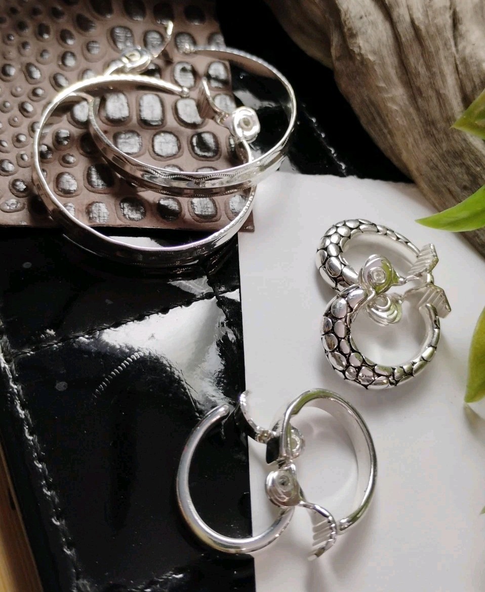 The JEWELRY GROUP TJG Set of THREE (3) Silver Toned Hoop Clip On Earrings!