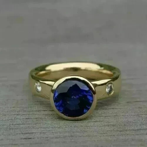 Lab-Created Blue Sapphire 2.1Ct Round Cut Engagement Ring 14K Yellow Gold Plated