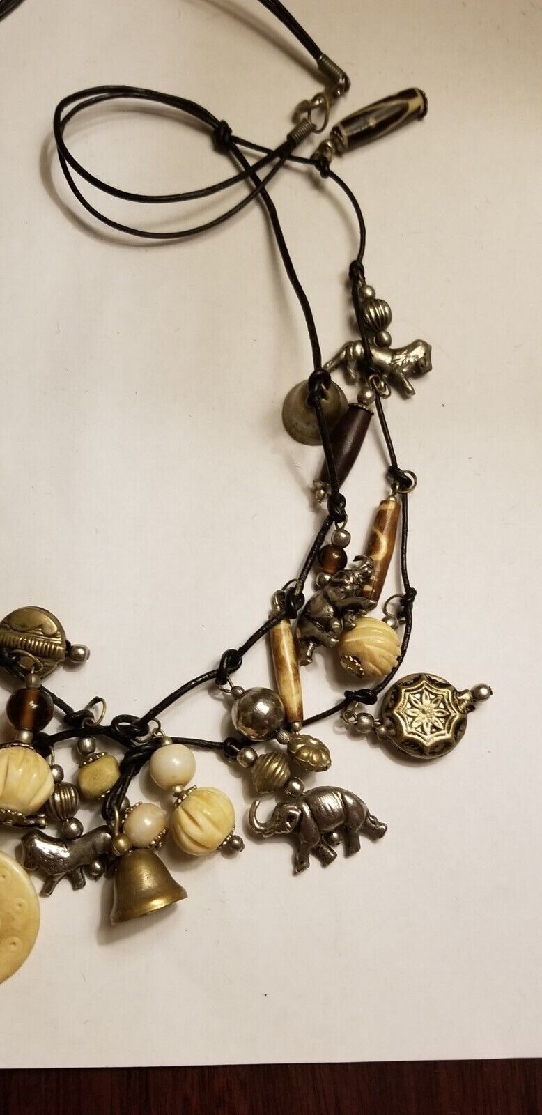 VINTAGE MOROCCAN ANIMAL CHARM NECKLACE LEATHER CORD SUSAN CUMMINGS STYLE
