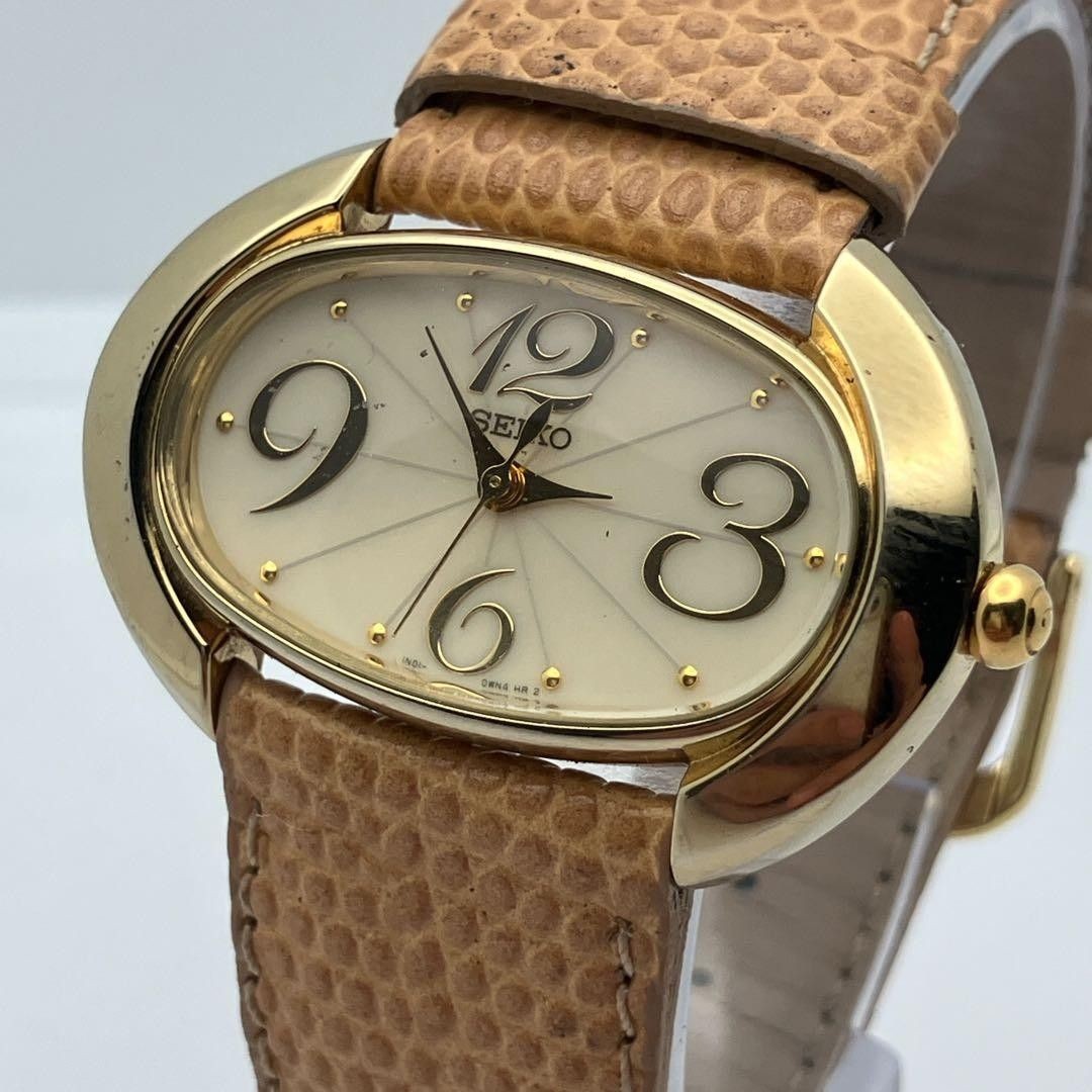 Working item SEIKO wristwatch oval quartz new battery ladies
