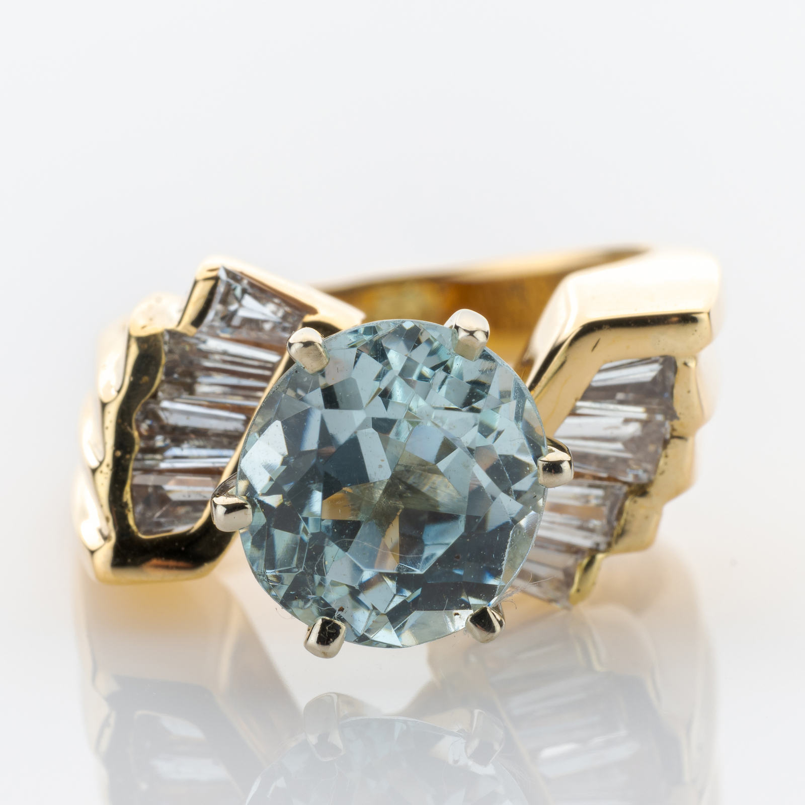 14k gold ring with an aquamarine and diamonds