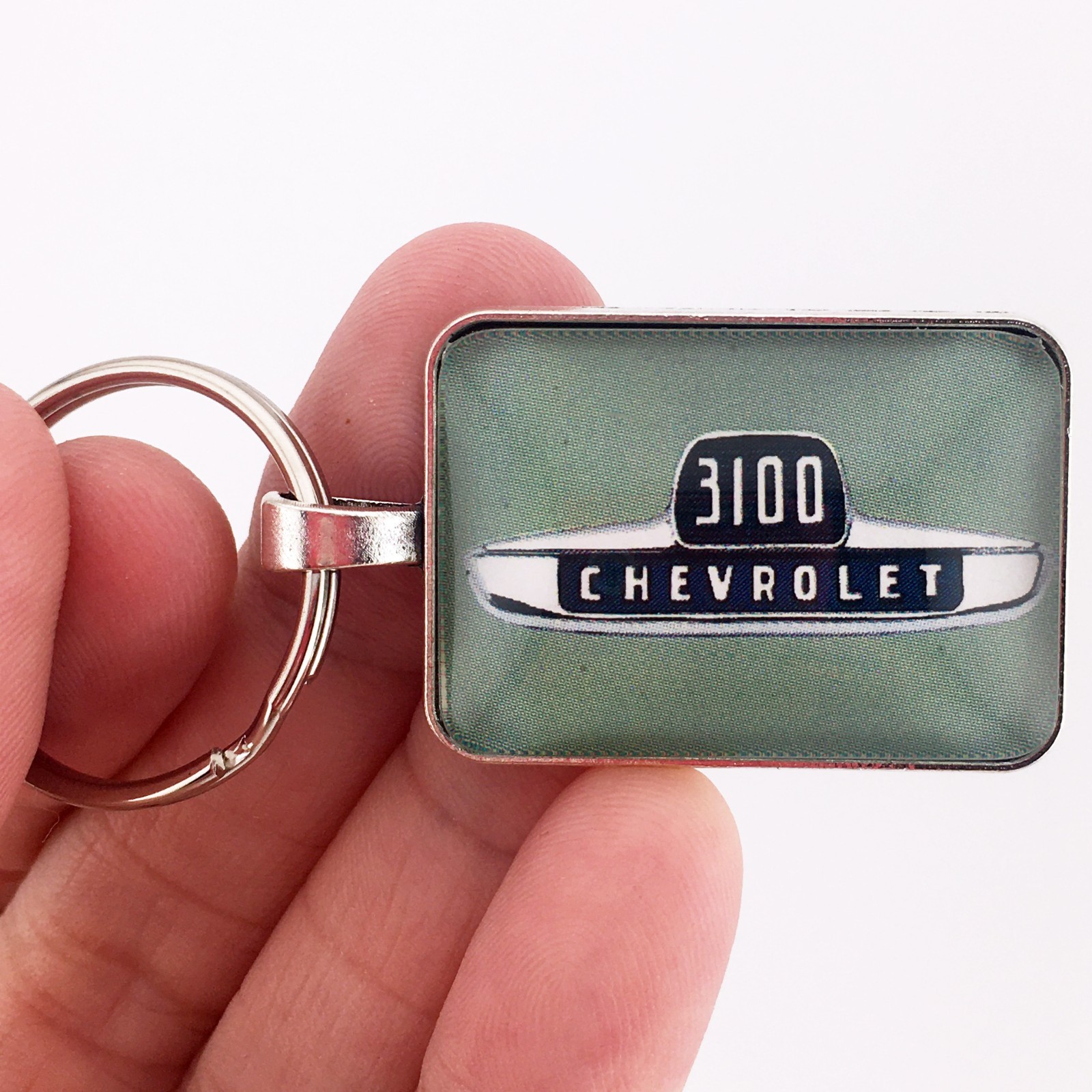 Vintage Chevrolet 3100 Chrome Fender Emblem Light Green 1″ xz 1.25″ Keychain